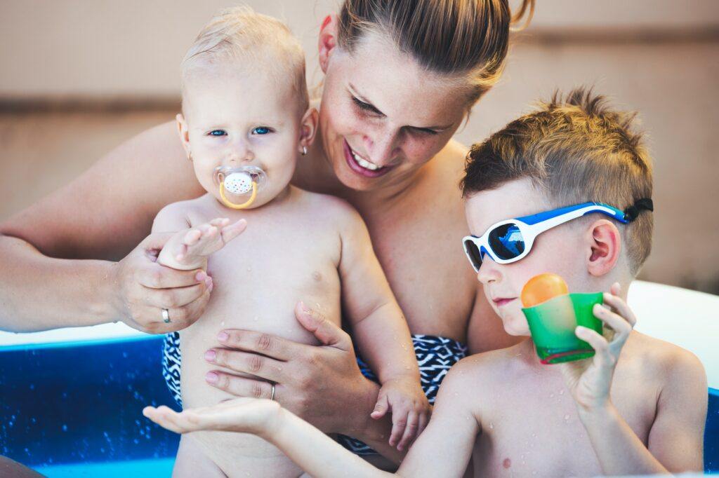 Picture of happy family in swimming pool